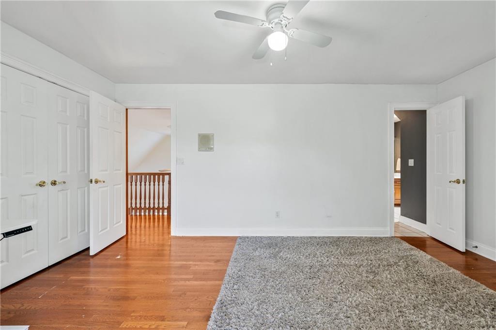 422 Blessings Lane Nicholson, GA 30565 - Photo 42 of 90 a view of empty room with wooden floor and fan