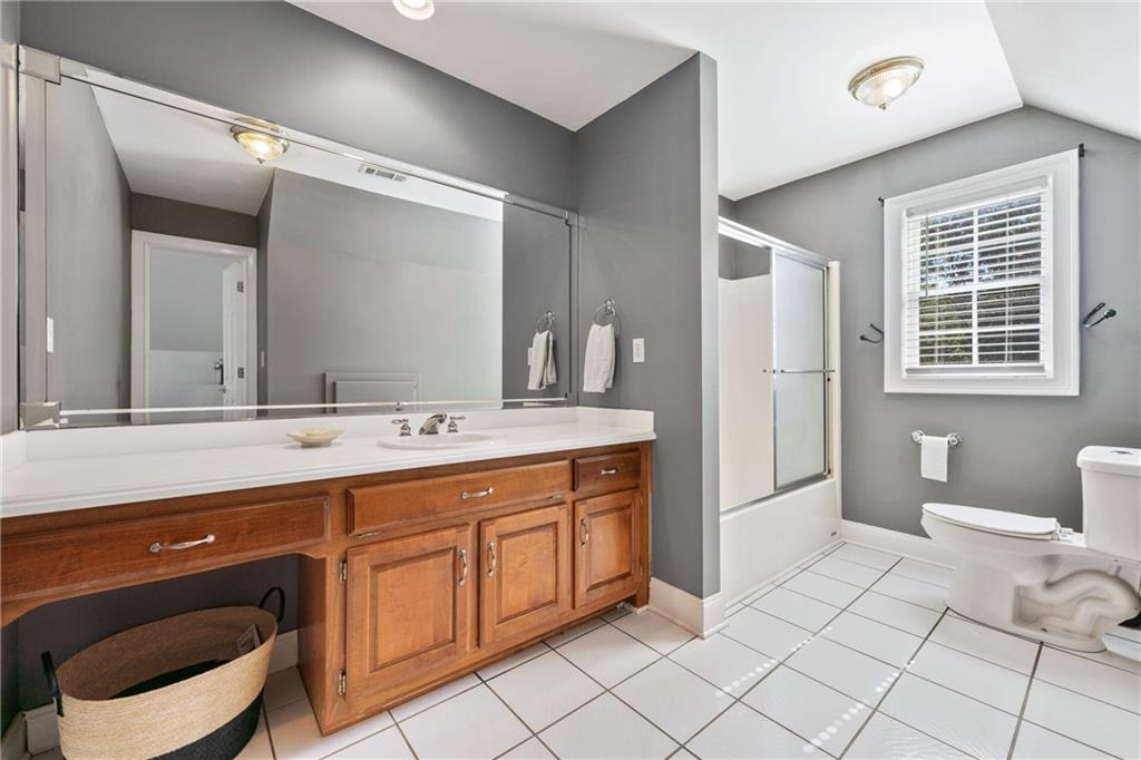 422 Blessings Lane Nicholson, GA 30565 - Photo 43 of 90 a spacious bathroom with a double vanity sink a mirror and a toilet