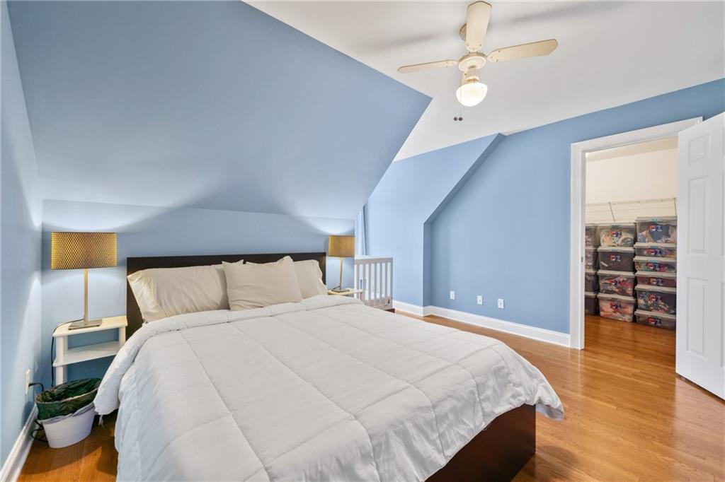 422 Blessings Lane Nicholson, GA 30565 - Photo 45 of 90 a large bed sitting in a bedroom and a chandelier