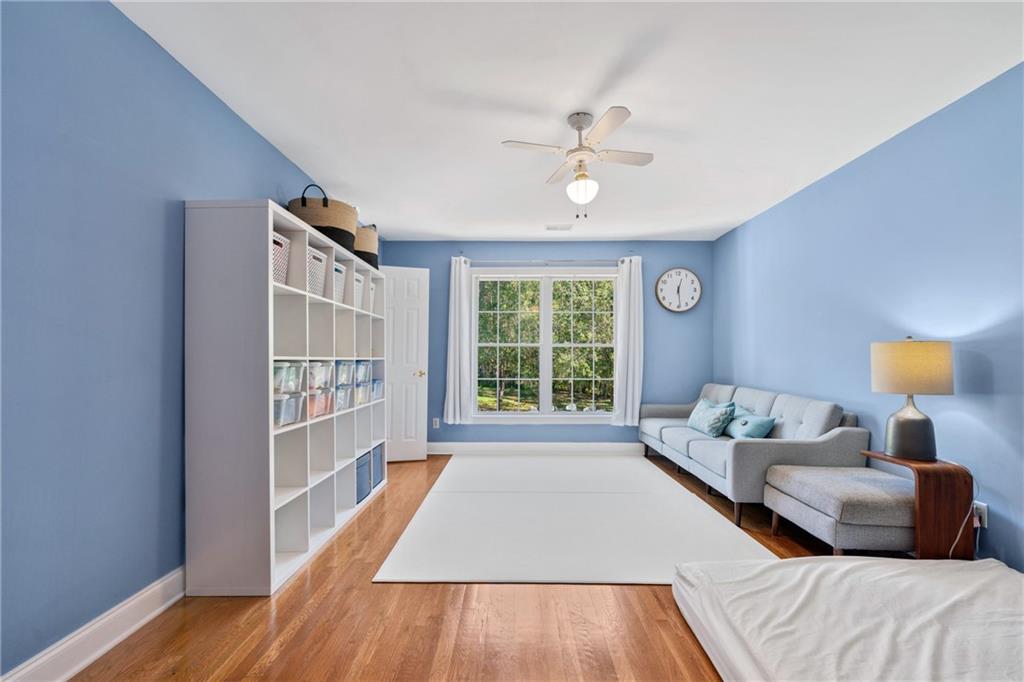 422 Blessings Lane Nicholson, GA 30565 - Photo 47 of 90 a living room with a bed furniture and a window