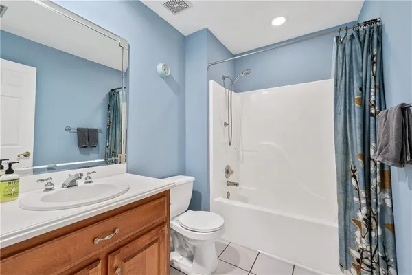 a view of a house with backyard and porch