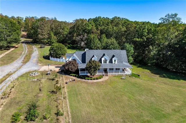 a bedroom with furniture and a wooden floor