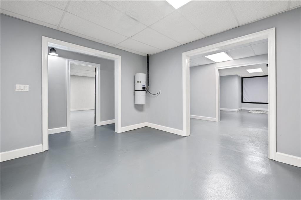 422 Blessings Lane Nicholson, GA 30565 - Photo 55 of 90 a view of an empty room with wooden floor and a bathroom