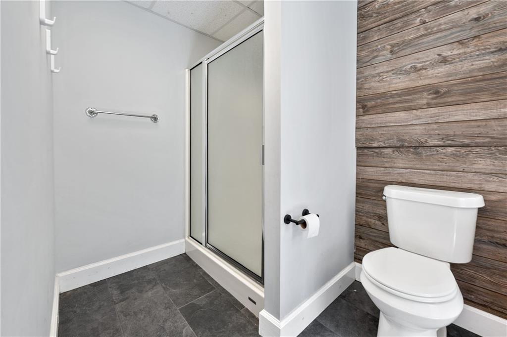 422 Blessings Lane Nicholson, GA 30565 - Photo 65 of 90 a white toilet sitting next to a shower