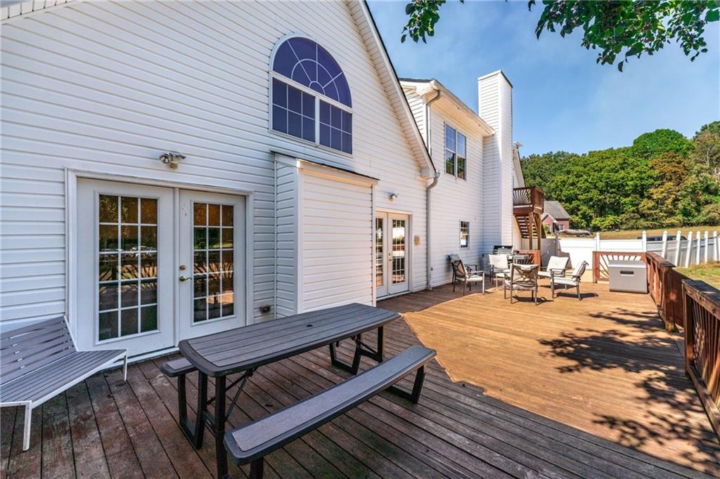 422 Blessings Lane Nicholson, GA 30565 - Photo 67 of 90 a view of a roof deck with wooden floor and seating space