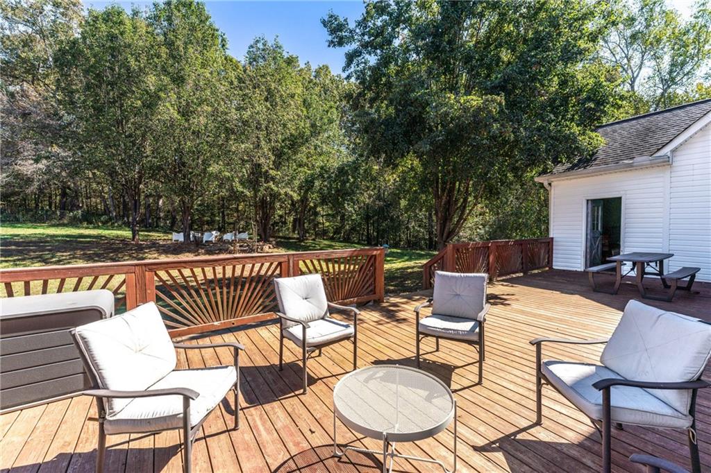 422 Blessings Lane Nicholson, GA 30565 - Photo 68 of 90 a view of a patio with a table and chairs