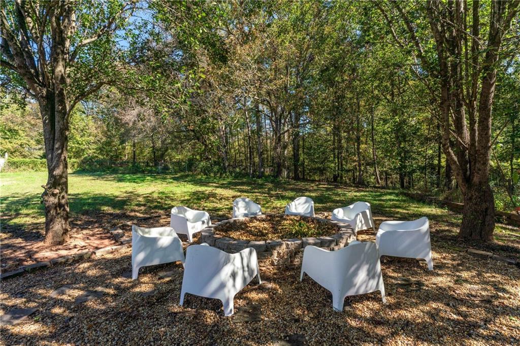 422 Blessings Lane Nicholson, GA 30565 - Photo 70 of 90 a backyard of a house with a yard and outdoor seating