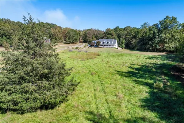 a kitchen with stainless steel appliances granite countertop a sink refrigerator and microwave
