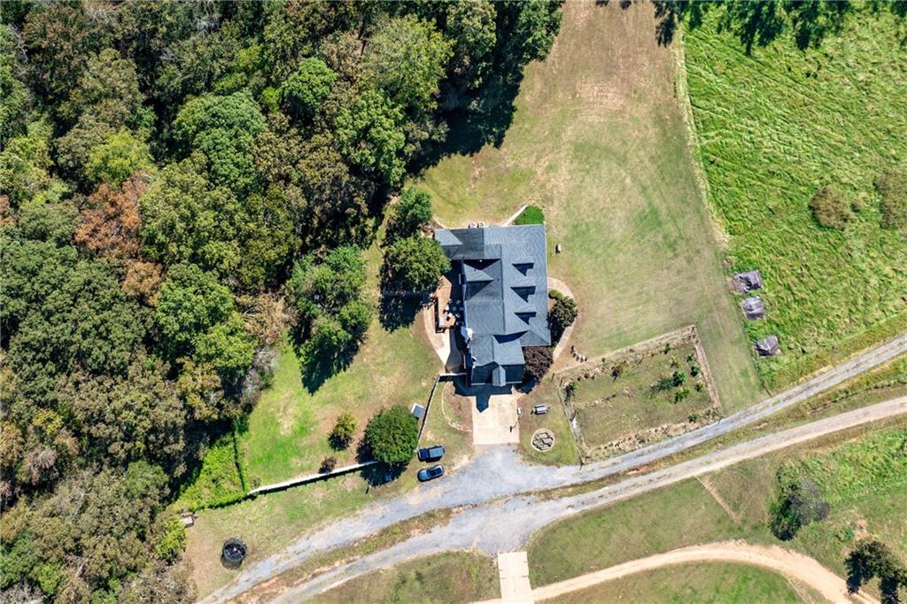 422 Blessings Lane Nicholson, GA 30565 - Photo 88 of 90 an aerial view of a house with a yard and sitting area