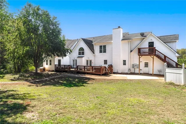 a kitchen with granite countertop a sink stove and cabinets
