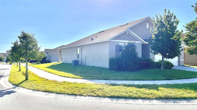a view of backyard with swimming pool and outdoor seating