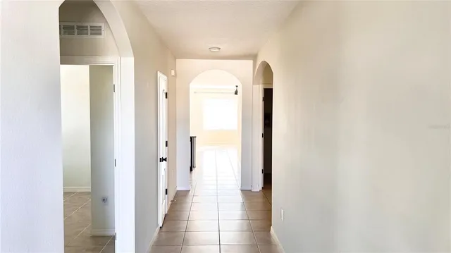 a view of a bathroom from a hallway