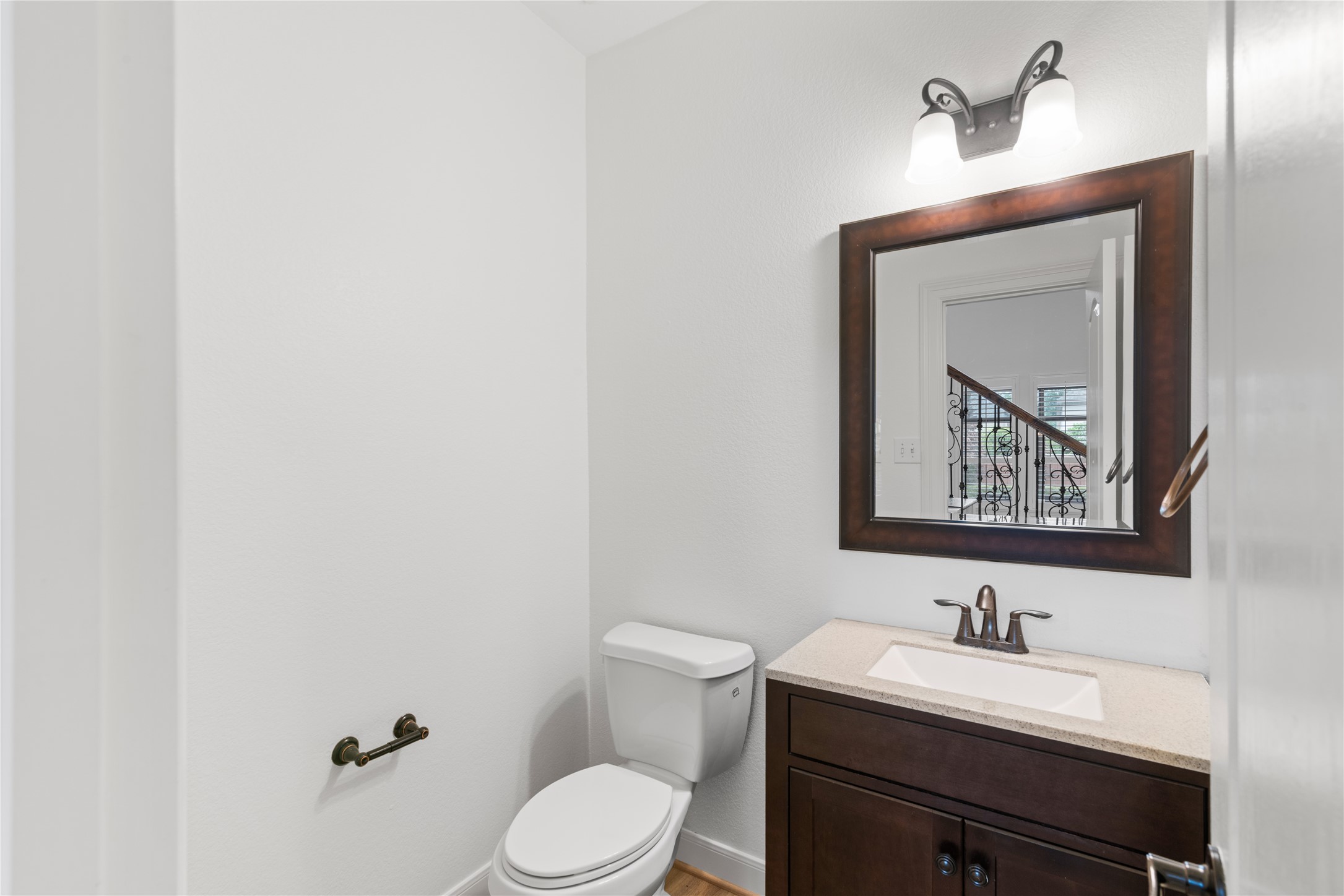 155 South Arrow Canyon Circle Spring, TX 77389 - Photo 23 of 49 The powder room located ideally closer to the garage entrance of the home, serves as a compact yet elegant space for guests with additional storage under the sink.
