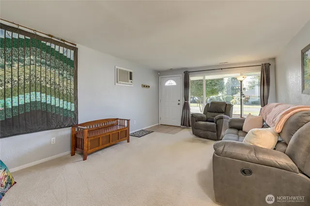 a living room with furniture and a window