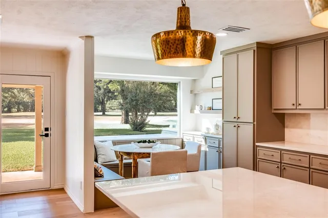 a view of a dining room with furniture and window