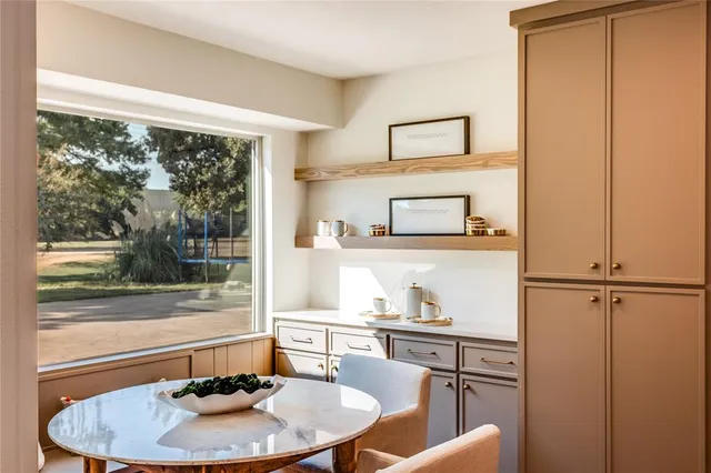 a kitchen with stainless steel appliances a stove sink and cabinets