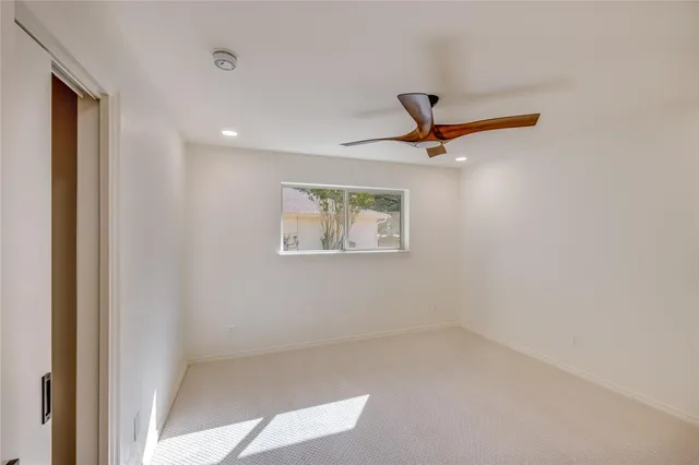 a bathroom with a double vanity sink a mirror and shower