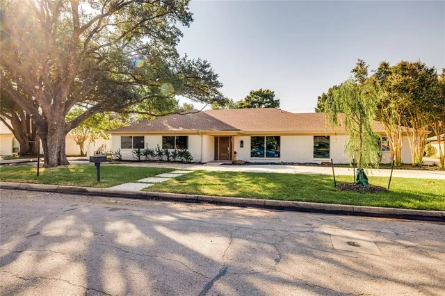 a view of house with outdoor space and street view
