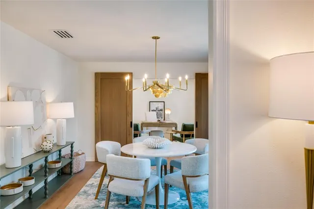 a kitchen with a sink a stove and cabinets