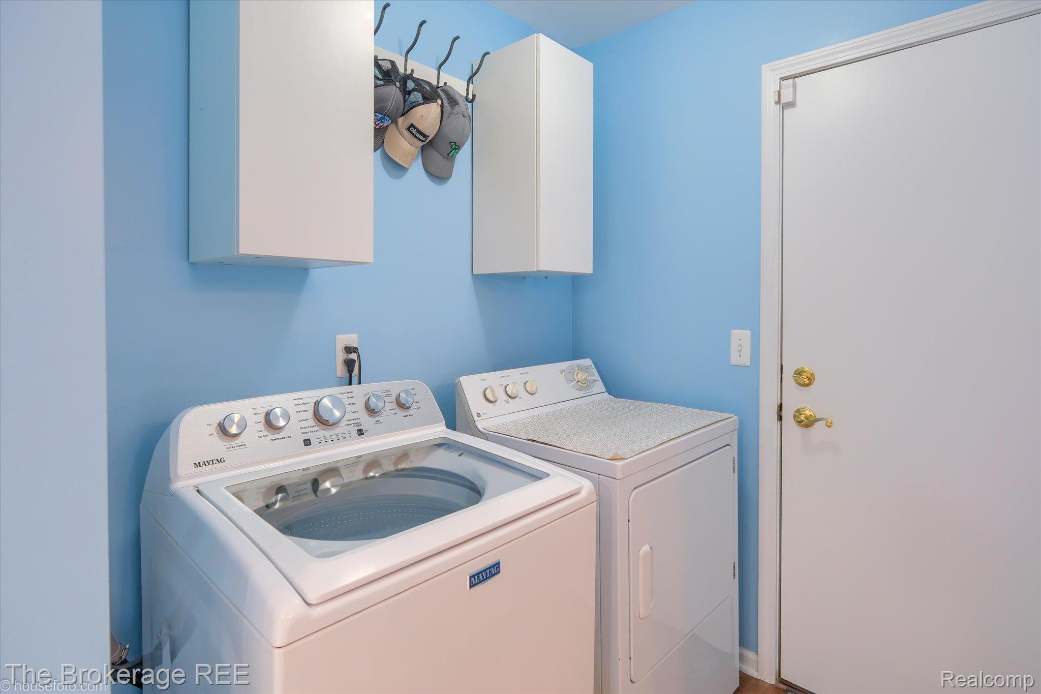 4432 North Belsay Road Flint, MI 48506 - Photo 44 of 79 Dedicated laundry space featuring a white top-load washer, a white dryer, and light blue wall color