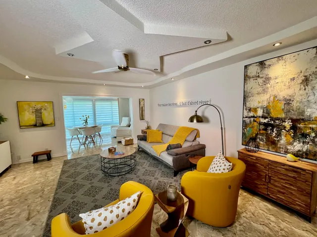 a kitchen with stainless steel appliances granite countertop a refrigerator stove top oven a sink and dishwasher