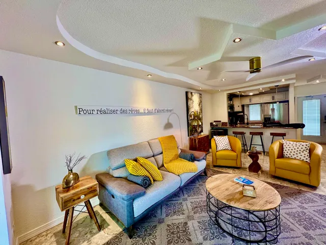 a kitchen with stainless steel appliances a stove a sink and a microwave