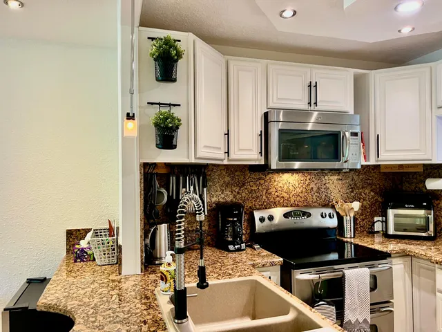 a view of staircase with a rug and a mirror