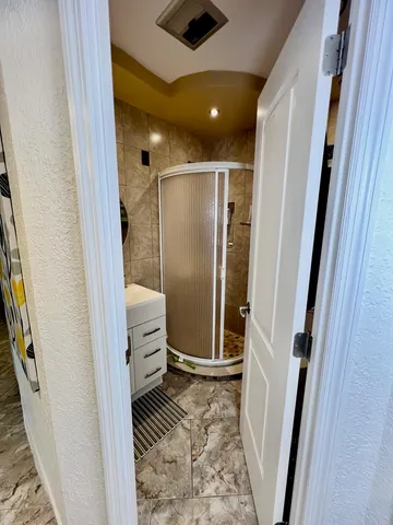 a front view of a house with swimming pool and sitting area