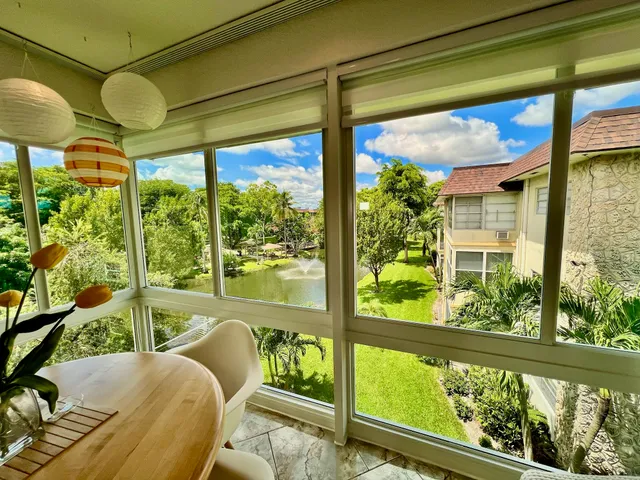 a kitchen with a stove a sink and a microwave