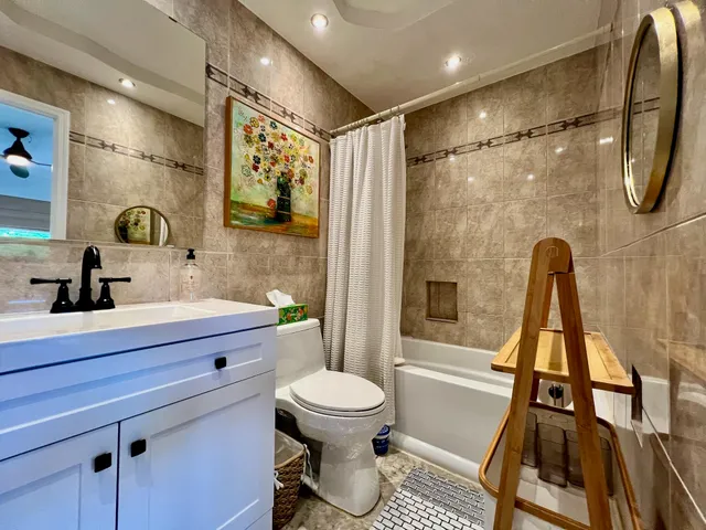 a view of a big yard with a large tree