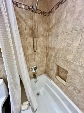 a view of a patio with a table chairs and a backyard