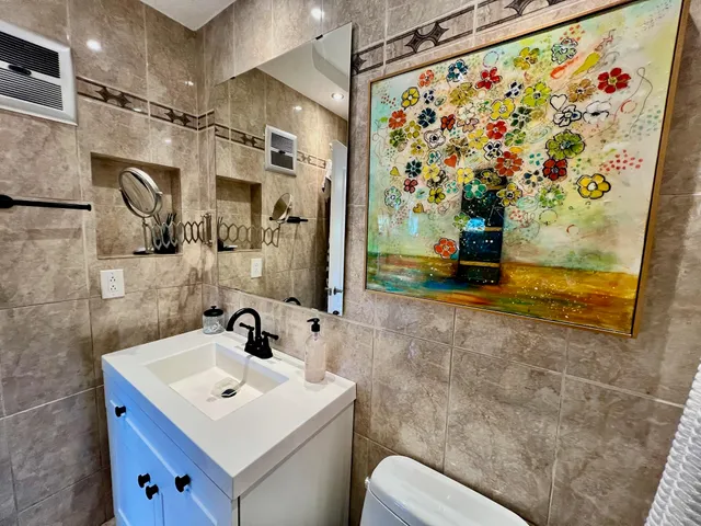 a living room with furniture gym equipment and a flat screen tv