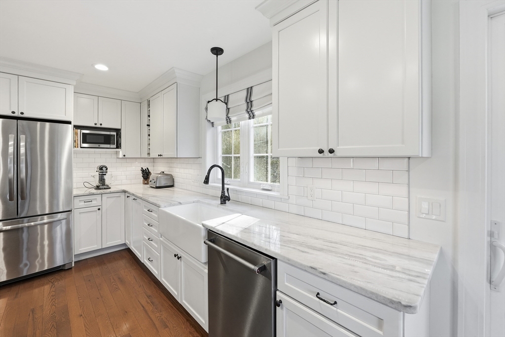 103 Rice Corner Road Brookfield, MA 01506 - Photo 8 of 39 a kitchen with stainless steel appliances granite countertop white cabinets and white appliances