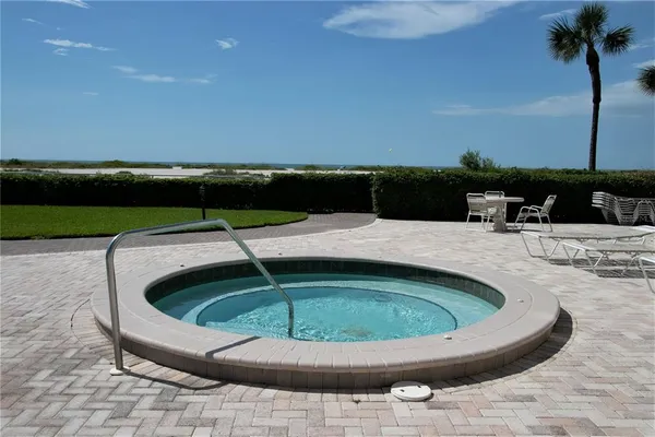 a view of swimming pool with seating area