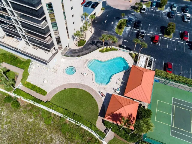an aerial view of a chairs and table