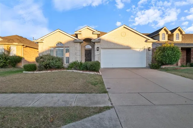 a view of house with yard and green space