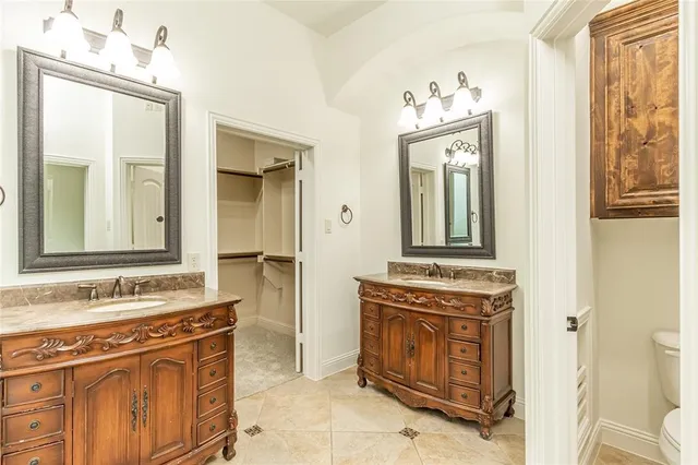 a bathroom with a sink vanity and a mirror