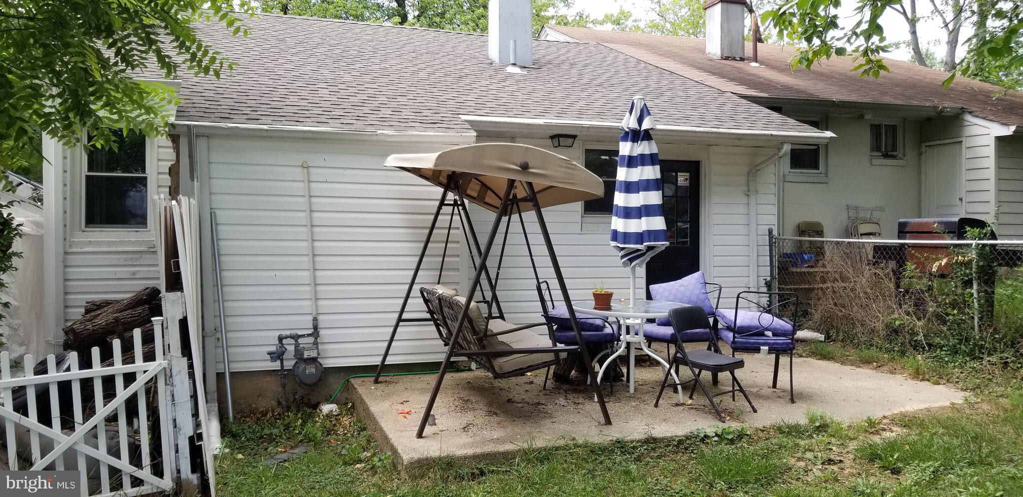 7717 Normandy Road Landover, MD 20785 - Photo 2 of 16 back yard and back view with patio