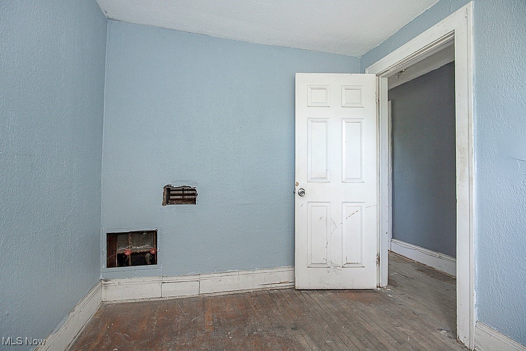 3538 Independence Road Cleveland, OH 44105 - Photo 17 of 24 Spare room featuring hardwood / wood-style flooring and baseboards