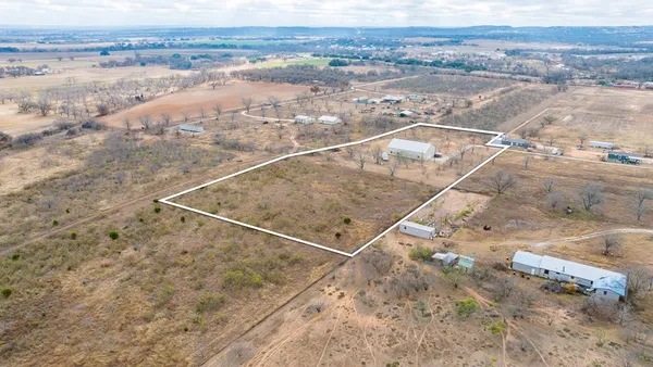 a view of an empty room with stairs