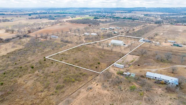 a view of an empty room with stairs