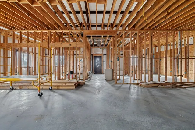 a view of parking garage with cars