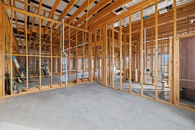 a view of parking garage with cars