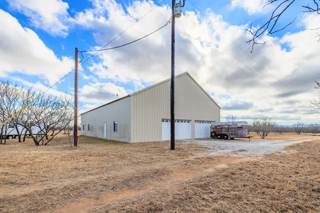 a view of a backyard of the house