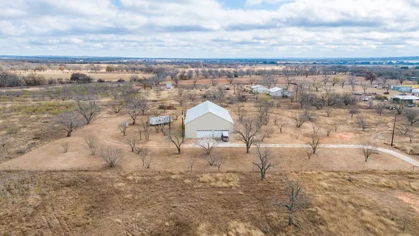 a view of outdoor space with playground and green space
