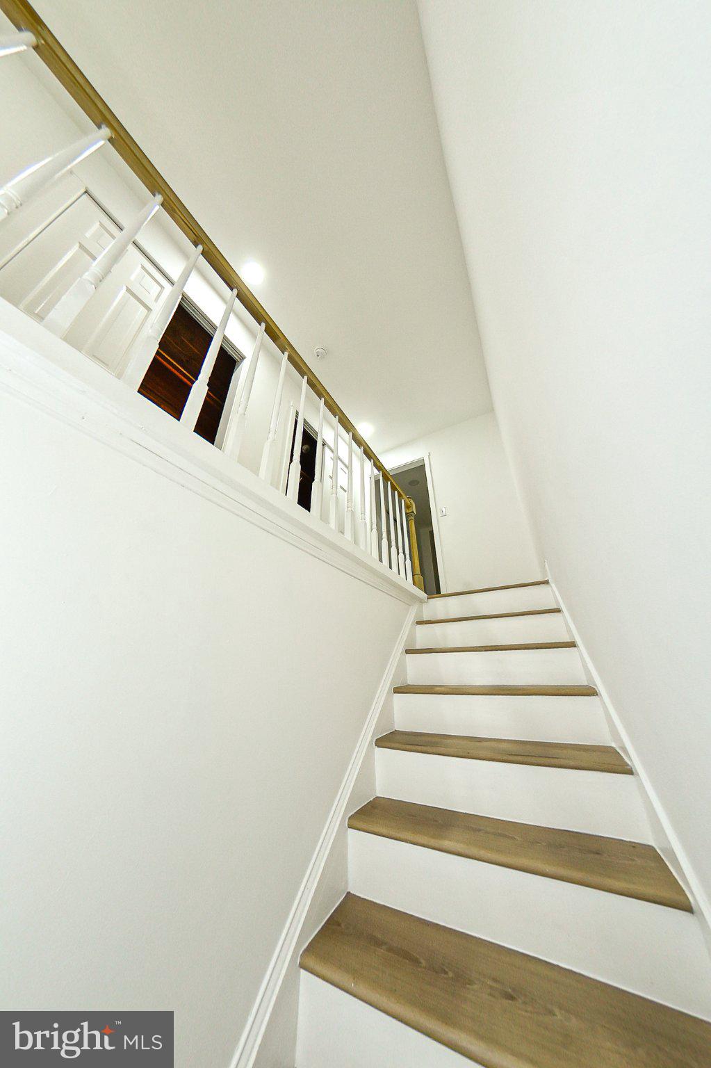 3704 Suitland Road Southeast Washington, DC 20020 - Photo 42 of 70 Bright and inviting staircase ascent.