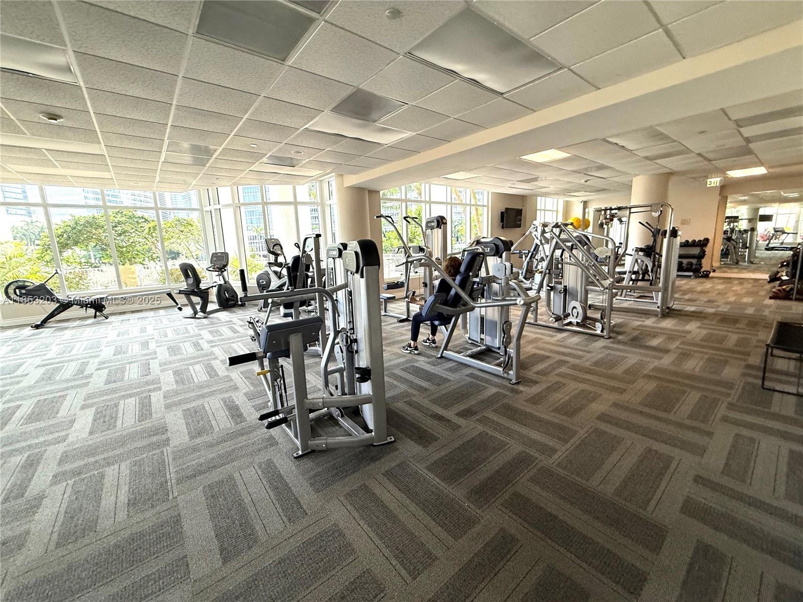 801 Brickell Key Boulevard, Unit 2402 Miami, FL 33131 - Photo 24 of 37 a view of a room with gym equipment
