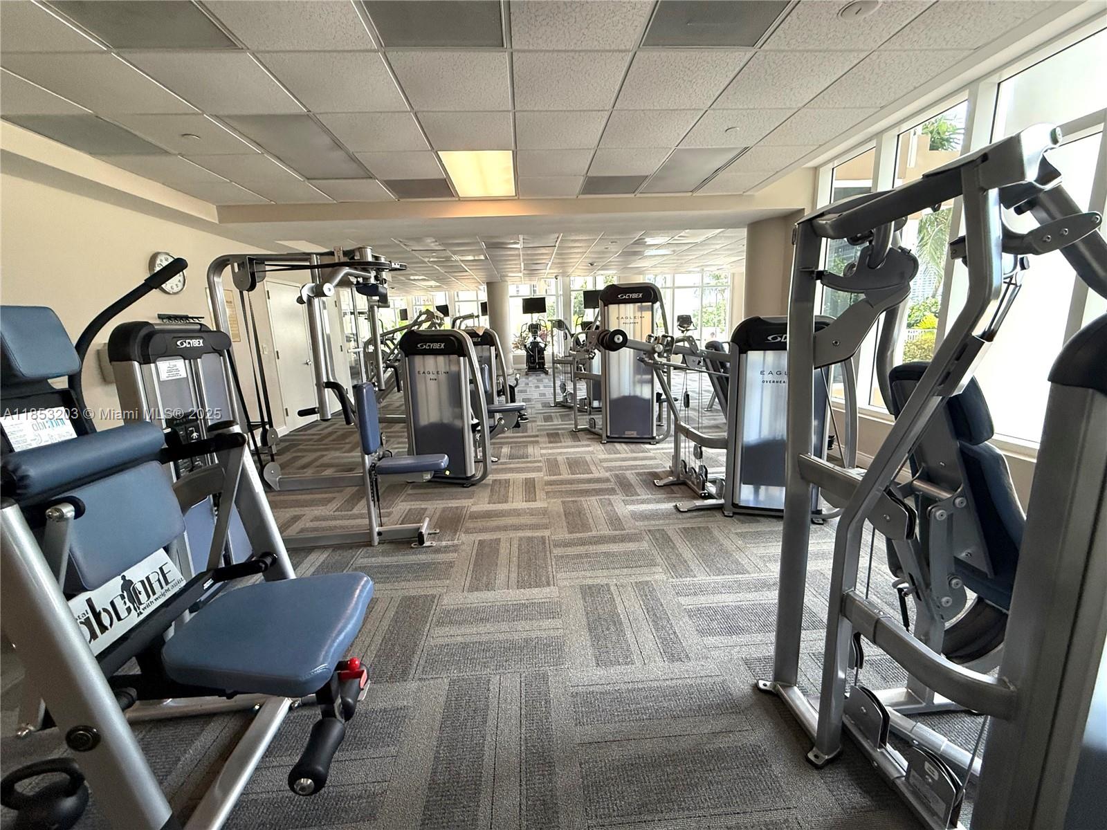 801 Brickell Key Boulevard, Unit 2402 Miami, FL 33131 - Photo 28 of 37 a view of a room with gym equipment