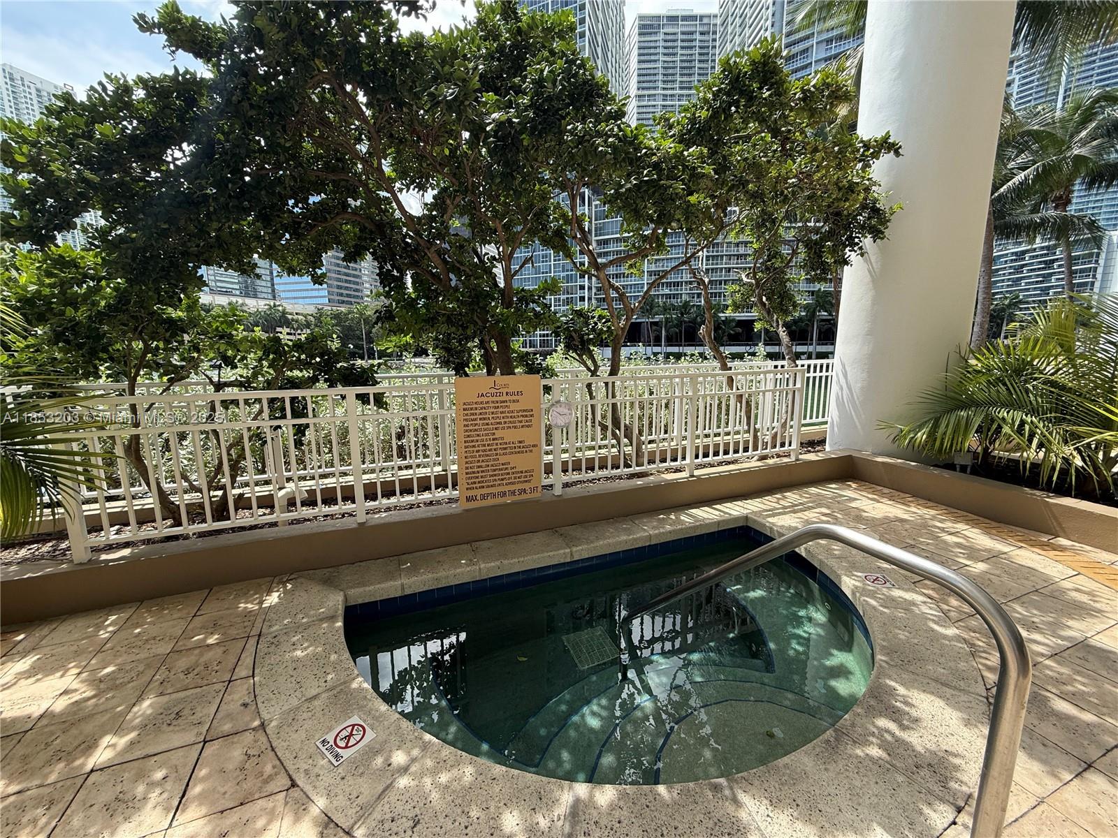 801 Brickell Key Boulevard, Unit 2402 Miami, FL 33131 - Photo 29 of 37 a view of swimming pool from a balcony