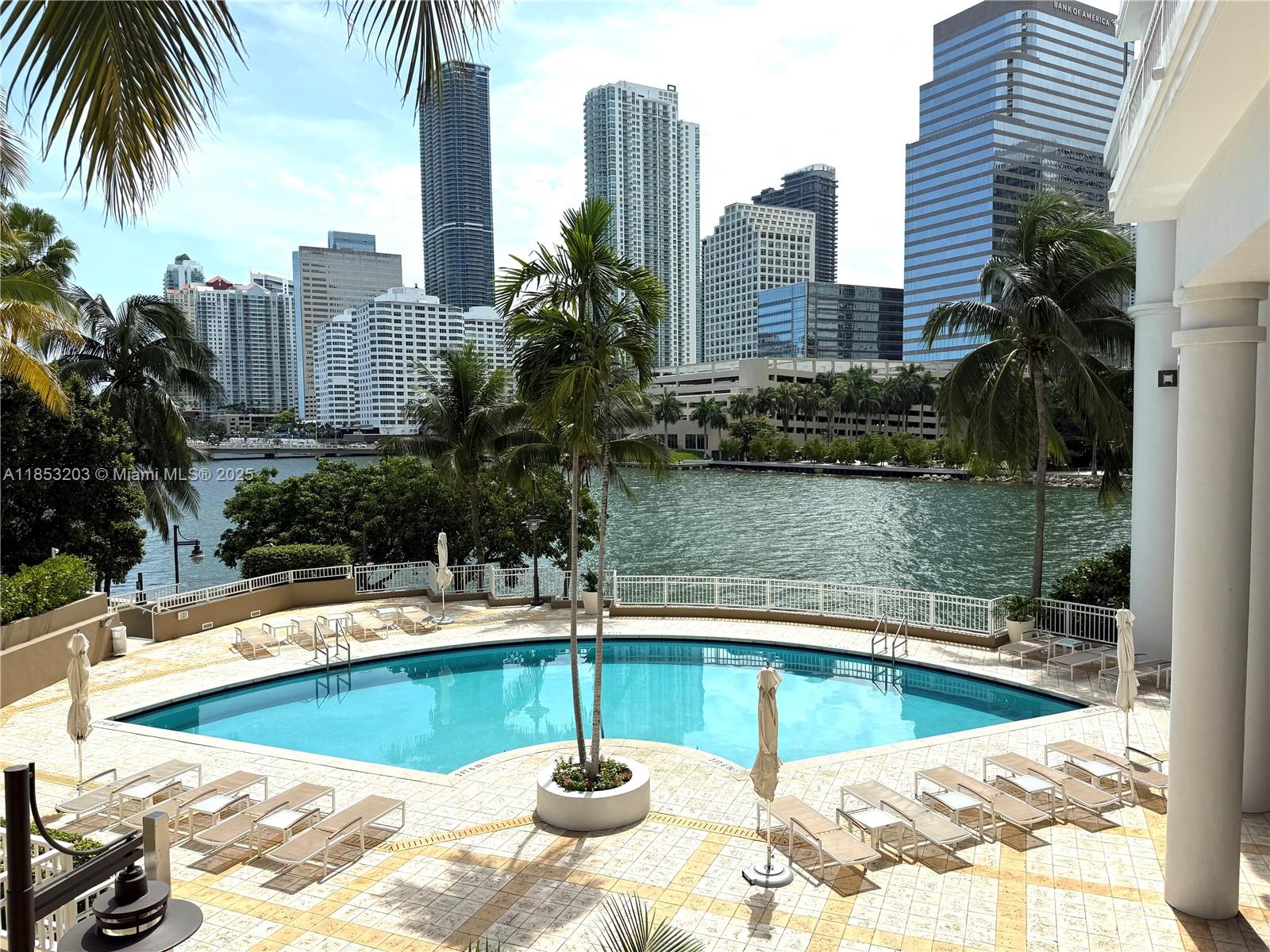 801 Brickell Key Boulevard, Unit 2402 Miami, FL 33131 - Photo 32 of 37 a view of a swimming pool with a patio